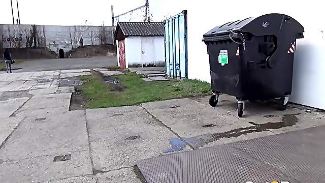 Shiny leggings girl pees behind a dumpster