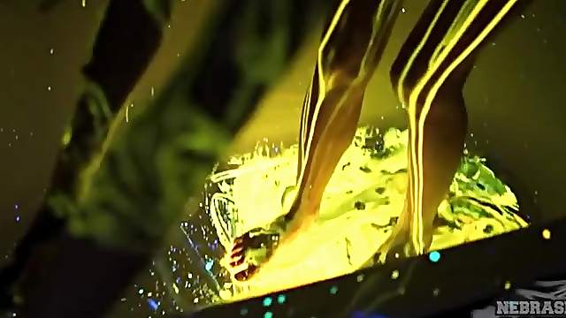 Beauty pours glow stick liquid all over her tight body