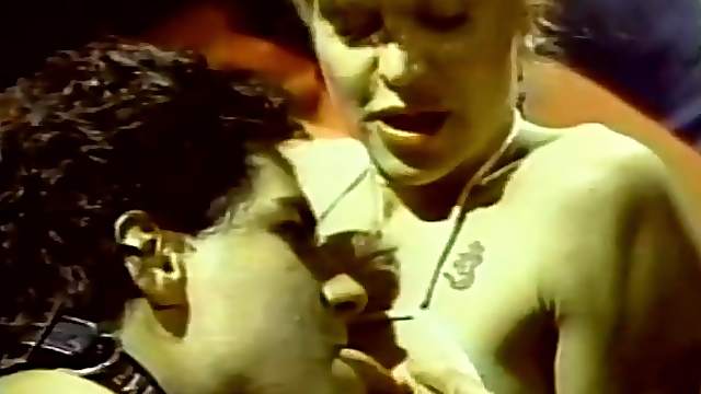 Elegant mistress dominates her slave couple