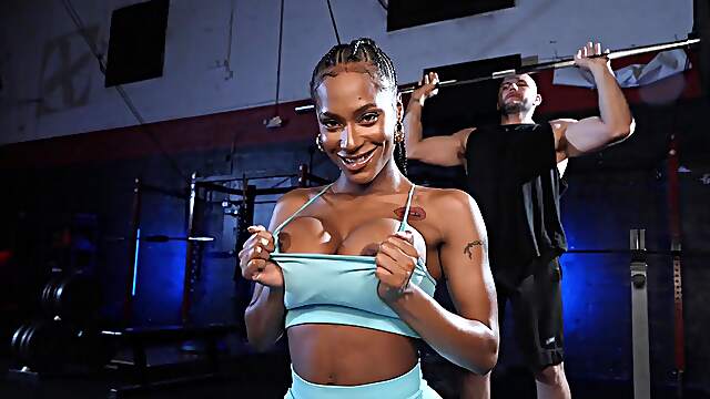 Aroused ebony gets intimate at the gym in naughty scenes
