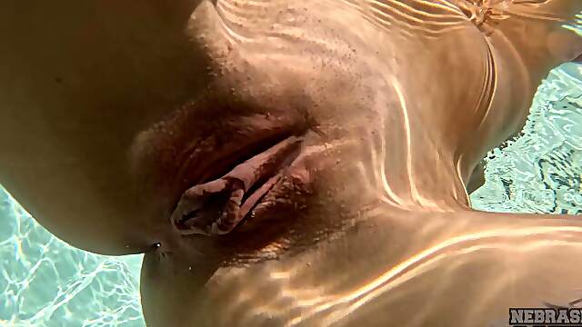 A sweet girl named Rosalinda has no boyfriend, so she plays with herself by the pool.