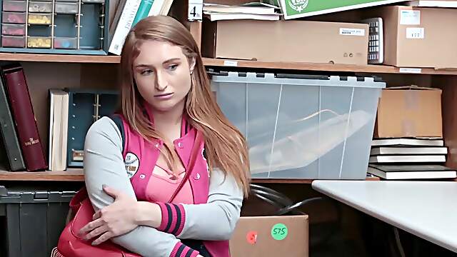 Redheaded vixen Skylar Snow flaunts her massive melons in a tight uniform