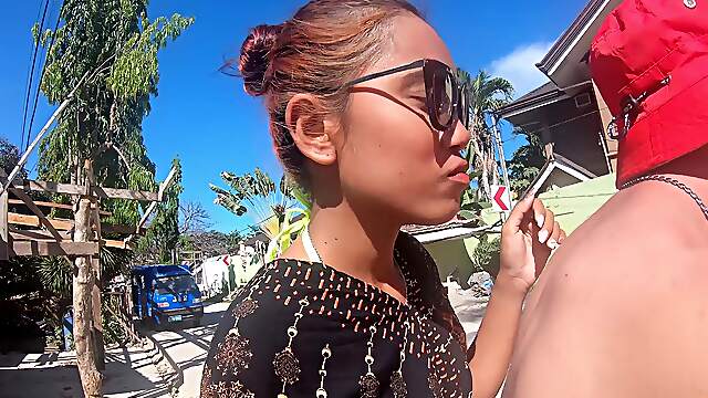Asian cutie in a bikini gives sensual POV handjob and sloppy BJ on the sunny Thai beach