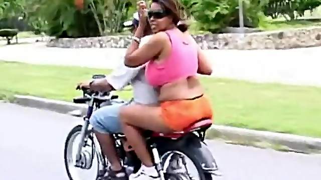 Huge tits girl on the back of a motorcycle