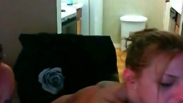 Nude blonde smokes a cigarette on webcam