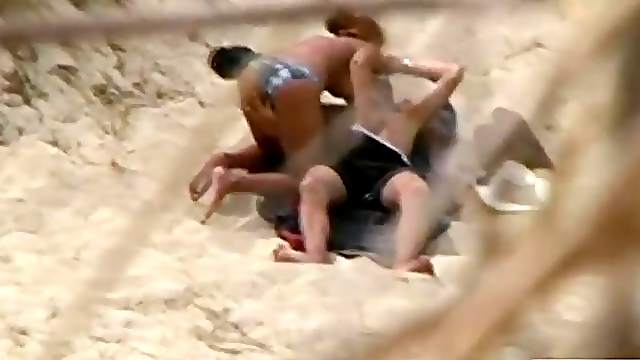 Hot couple caught having sex on the beach