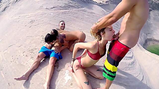 Outdoor foursome at the beach for two slutty teens
